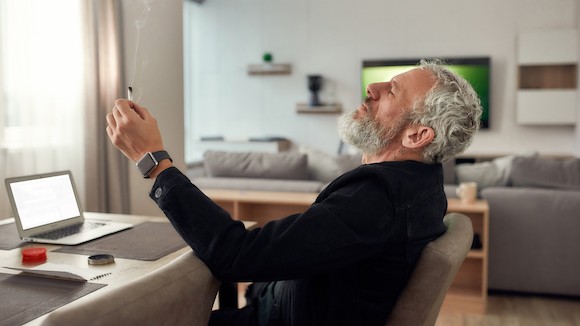 senior man smoking entire weed joint enjoy calm relax mind