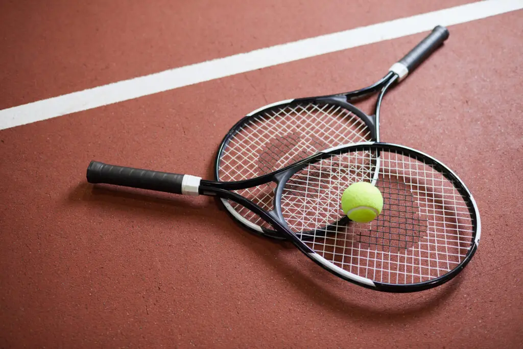 How To Incorporate Cannabis Into Your BNP Paribas Open Plans 1 two tennis rackets and a tennis ball stacked on a tennis court